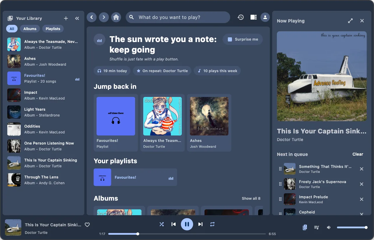 The Ariami desktop home screen with library sidebar and queue